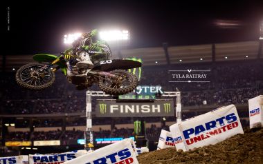 Motocross Rider Jumping Over Finish Line