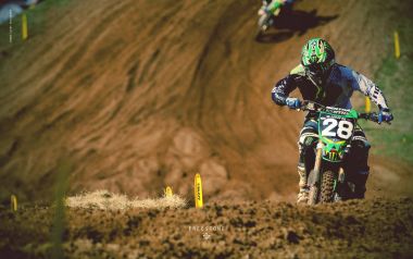 Motocross Rider Racing On Dirt Track With Number 28