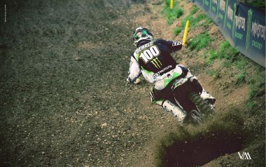 Motocross Rider Racing On Dirt Track