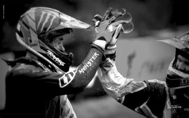 Motocross Riders High Fiving Moment