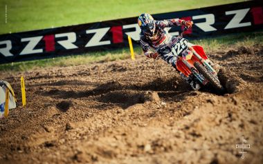 Off Road Motocross Rider On Dirt Track Racing Scene