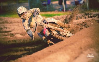 Motocross Rider On Dirt Track Racing Scene