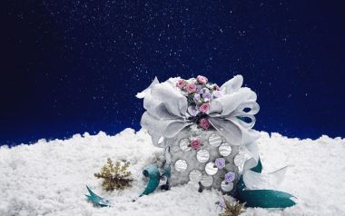 Winter Gift Box With Pink Flowers On Blue Background