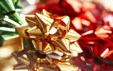Close Up Of Gold Red And Green Metallic Holiday Bows