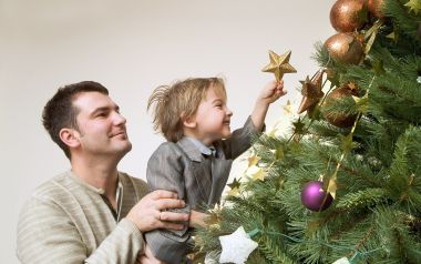 Father And Son Decorating Christmas Tree