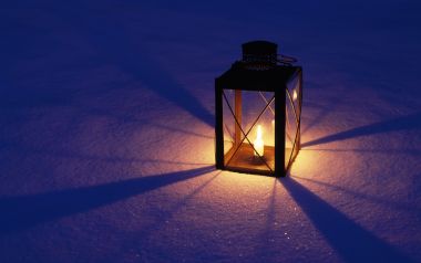 Glowing Lantern In Snowy Night