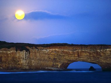 Moon Rising Over California Coastal Cliffs Natural Sea Arch