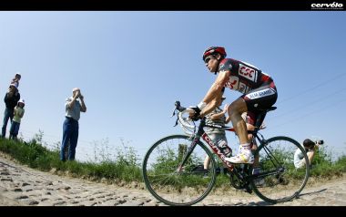 Cervelo Brand Cyclist Riding On Cobblestone Road