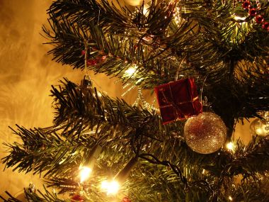 Warm Christmas Tree Lights And Ornaments Closeup