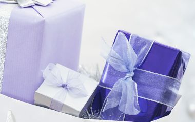 Purple And White Wrapped Gift Boxes Close Up