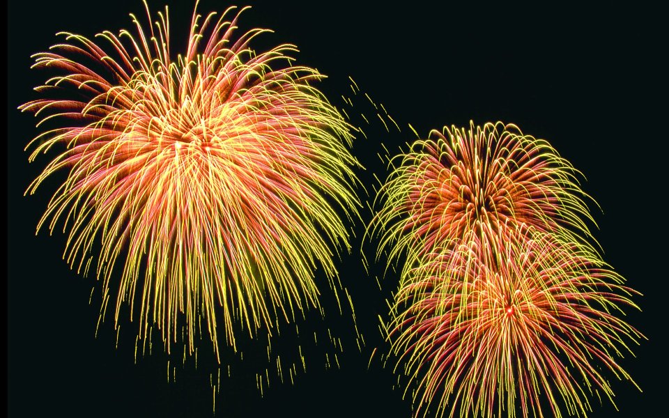 Red Yellow Gradient Festival Fireworks Display On Dark Night Sky