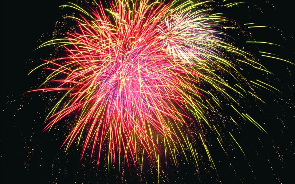 Vibrant Red Yellow Festive Fireworks Display At Night