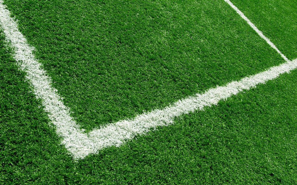 Football Field Green Artificial Turf White Markings Closeup