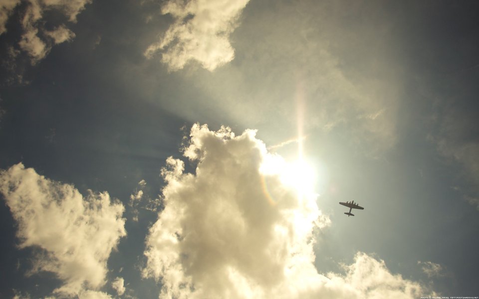 Vintage Airplane Flying In Sunlit Clouds Untitled I