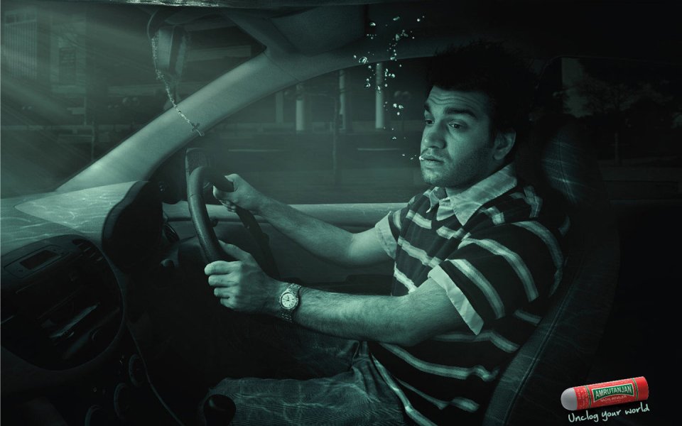 Man Driving Car Amrutanjan Ad