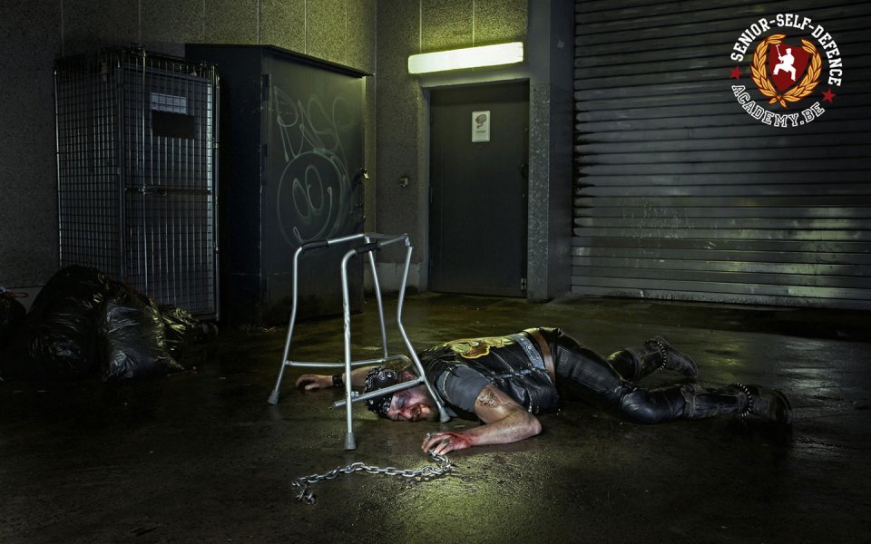 German Biker Laying On Ground Alley