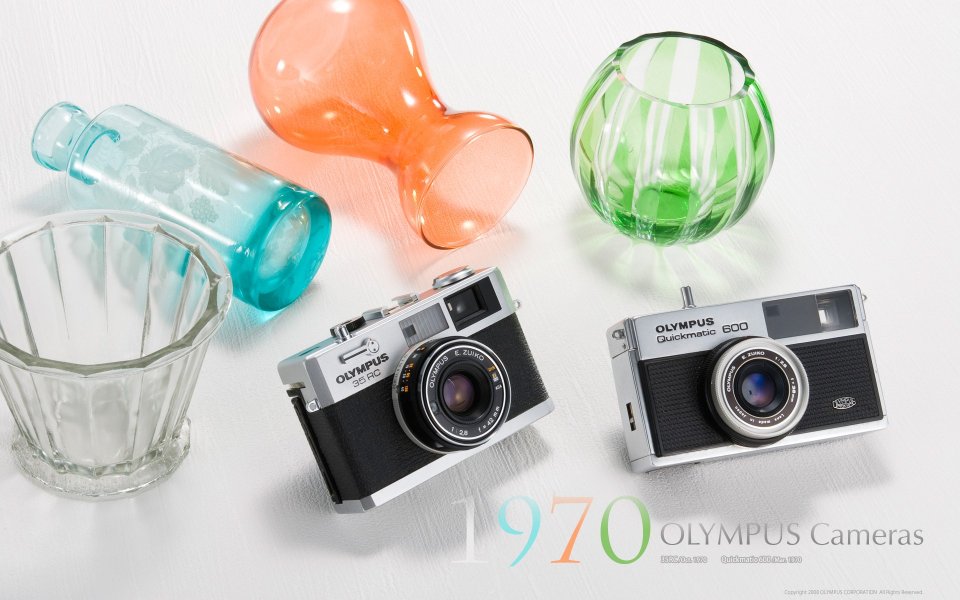 Olympus 1970 Retro Cameras And Colorful Glassware