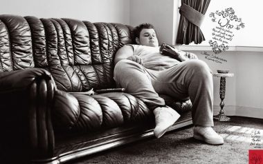 Man Lying On Sofa With Shakespeare Quotes